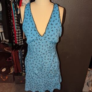 Vibrant Blue Sleeveless Dress with Floral Design